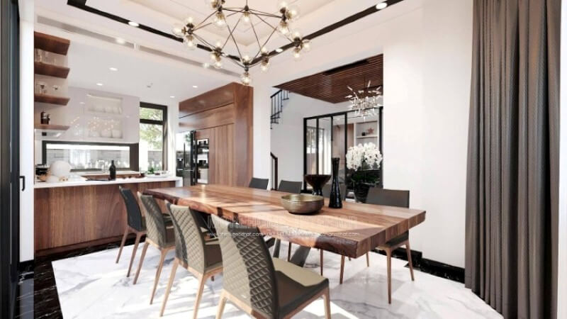 Ngoài điểm đặc biệt từ cách bố trí kệ trang trí, bàn đảo bằng đá nhân tạo LG màu trắng được thiết kế phô ra ngoài lại là điểm đáng chú ý, một mặt vẫn đảm bảo diện tích để chủ nhân có thể phô diễn món ăn thỏa mái, một mặt bạn lại có thể vừa nội trợ vừa có thể để mắt con học một cách dễ dàng. Tủ bếp gỗ công nghiệp và tủ bếp acrylic